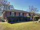 Brick ranch house with a well-manicured lawn and hedges at 197 Dixboro Dr, Jonesboro, GA 30238