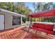 Deck with red swing and view of backyard at 197 Dixboro Dr, Jonesboro, GA 30238