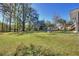 Spacious backyard with trees and playset at 197 Dixboro Dr, Jonesboro, GA 30238