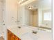 Double vanity bathroom with a large mirror and a shower at 4815 Candy Cv, Lithonia, GA 30038