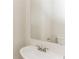 Small bathroom with pedestal sink and mirror at 4815 Candy Cv, Lithonia, GA 30038