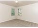 Well-lit bedroom with two windows and carpet floors at 4815 Candy Cv, Lithonia, GA 30038