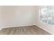 Bedroom with wood-look flooring and large window at 4815 Candy Cv, Lithonia, GA 30038