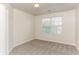 Bright bedroom with large window and carpet floors at 4815 Candy Cv, Lithonia, GA 30038