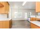 Kitchen with light wood cabinets, granite countertops, and access to deck at 4815 Candy Cv, Lithonia, GA 30038