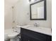 Updated bathroom with dark vanity, marble countertop and hexagon tile at 3015 Flat Shoals Rd, Atlanta, GA 30349