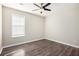 Bright bedroom with wood-look floors and ceiling fan at 3015 Flat Shoals Rd, Atlanta, GA 30349