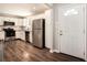 Modern kitchen with stainless steel appliances and dark wood-look floors at 3015 Flat Shoals Rd, Atlanta, GA 30349
