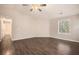 Spacious living room featuring wood-look floors and a ceiling fan at 3015 Flat Shoals Rd, Atlanta, GA 30349