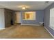 Large living room with neutral colored walls and carpet at 2820 Brookford Sw Ln, Atlanta, GA 30331