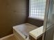 Bathroom with soaking tub, double vanity, and separate shower at 2820 Brookford Sw Ln, Atlanta, GA 30331