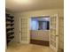 Bright bedroom with built-in shelves and French doors at 2820 Brookford Sw Ln, Atlanta, GA 30331