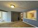 Open living room featuring neutral walls and carpet at 2820 Brookford Sw Ln, Atlanta, GA 30331