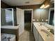 Main bathroom features a double vanity and a view of the bedroom at 2820 Brookford Sw Ln, Atlanta, GA 30331