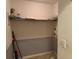 Laundry closet with shelving and space for washer and dryer at 2820 Brookford Sw Ln, Atlanta, GA 30331