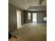 Large main bedroom with a tray ceiling and backyard access at 2820 Brookford Sw Ln, Atlanta, GA 30331