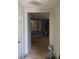 A hallway with carpet flooring and a view of the living room at 2820 Brookford Sw Ln, Atlanta, GA 30331