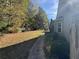 Backyard with walkway and mature trees at 2820 Brookford Sw Ln, Atlanta, GA 30331
