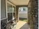 Stone front porch with view of backyard at 2820 Brookford Sw Ln, Atlanta, GA 30331