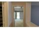 Hallway with doors leading to various rooms and backyard access at 2820 Brookford Sw Ln, Atlanta, GA 30331