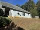 Side view of house, showcasing siding and landscaping at 2820 Brookford Sw Ln, Atlanta, GA 30331