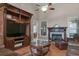 Living room with fireplace, built-in entertainment center and hardwood floors at 620 Springview Dr, Covington, GA 30014