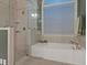 Spa-like bathroom with soaking tub and walk-in shower at 620 Springview Dr, Covington, GA 30014