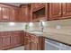 Modern kitchen featuring granite countertops and ample cabinetry at 620 Springview Dr, Covington, GA 30014