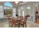 Breakfast area with large windows and wood table with seating for six at 620 Springview Dr, Covington, GA 30014