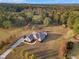 Aerial view of home on large lot with mature trees at 620 Springview Dr, Covington, GA 30014
