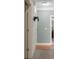 Clean and bright hallway with hardwood floors and neutral colored walls at 620 Springview Dr, Covington, GA 30014