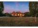Brick house on a large lot at dusk at 620 Springview Dr, Covington, GA 30014