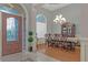 Formal dining room with hardwood floors, chandelier, and large windows at 620 Springview Dr, Covington, GA 30014