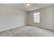 Spacious bedroom with grey carpet and large window at 4282 Portsbrook Ave, Snellville, GA 30039