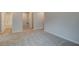 Upstairs hallway with grey carpet and access to bathroom at 4282 Portsbrook Ave, Snellville, GA 30039