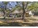 Ranch house nestled among mature trees at 3520 Tom Brewer Rd, Loganville, GA 30052