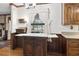 Charming kitchen features wood cabinets and a built-in kitchen island at 3520 Tom Brewer Rd, Loganville, GA 30052