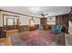 Spacious living room featuring built-in shelving and a cozy fireplace at 3520 Tom Brewer Rd, Loganville, GA 30052