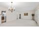 Bright dining room with chandelier and neutral carpeting at 3520 Tom Brewer Rd, Loganville, GA 30052