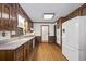 Kitchen with wood cabinets, granite countertops, and white appliances at 3520 Tom Brewer Rd, Loganville, GA 30052