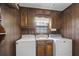 Bright laundry room with cabinets and a window at 3520 Tom Brewer Rd, Loganville, GA 30052