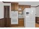 Kitchen with white appliances and ample wood cabinetry at 3520 Tom Brewer Rd, Loganville, GA 30052