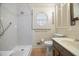 Updated bathroom with walk-in shower and grab bars at 3520 Tom Brewer Rd, Loganville, GA 30052