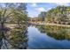 Serene pond reflecting autumn trees and sky at 3520 Tom Brewer Rd, Loganville, GA 30052