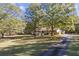 Ranch house with long driveway and spacious yard at 3520 Tom Brewer Rd, Loganville, GA 30052