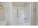 Clean bathroom with a shower/tub combo and white fixtures at 3520 Tom Brewer Rd, Loganville, GA 30052