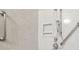 Accessible shower with multiple shower heads and grab bars at 3520 Tom Brewer Rd, Loganville, GA 30052