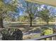 Peaceful backyard with lush greenery and a pond at 3520 Tom Brewer Rd, Loganville, GA 30052
