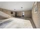 Spacious covered patio with concrete flooring, offering extra outdoor space at 3520 Tom Brewer Rd, Loganville, GA 30052