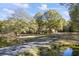 Ranch house with pond and long driveway at 3520 Tom Brewer Rd, Loganville, GA 30052